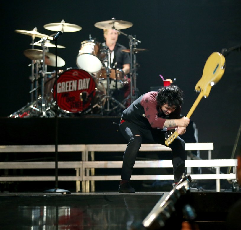 Billie Joe Armstrong making a racket on stage /Christopher Polk /Getty Images